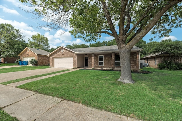 6102 Azalea Dr, Rowlett, TX 75089 - single story home featuring an attached garage, driveway, brick siding, a front lawn, and a shingled roof
