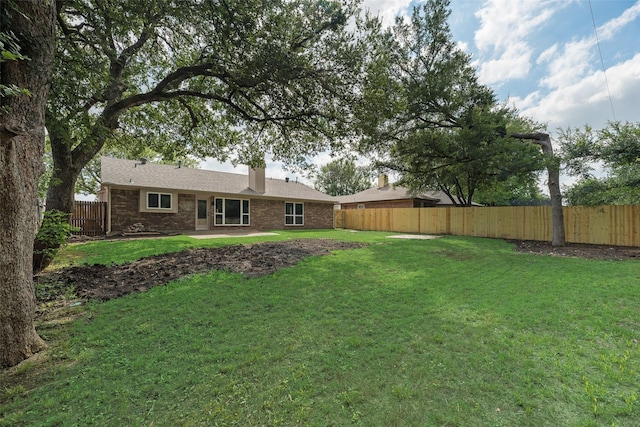 6102 Azalea Dr, Rowlett, TX 75089 - rear view of property with brick siding and a chimney