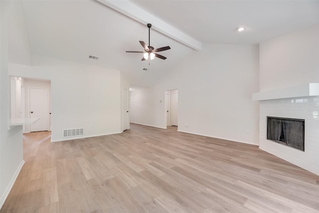 6102 Azalea Dr, Rowlett, TX 75089 - unfurnished living room with a ceiling fan, a brick fireplace, beamed ceiling, light wood-style flooring, and high vaulted ceiling