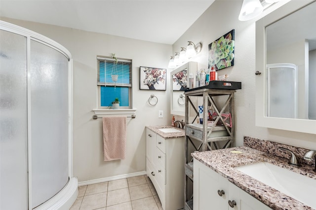 4920 Brookhollow Dr, Sachse, TX 75048 - full bathroom featuring a shower stall, two vanities, tile patterned floors, and baseboards