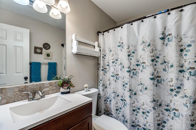 4920 Brookhollow Dr, Sachse, TX 75048 - full bath featuring vanity, toilet, backsplash, and a shower with curtain