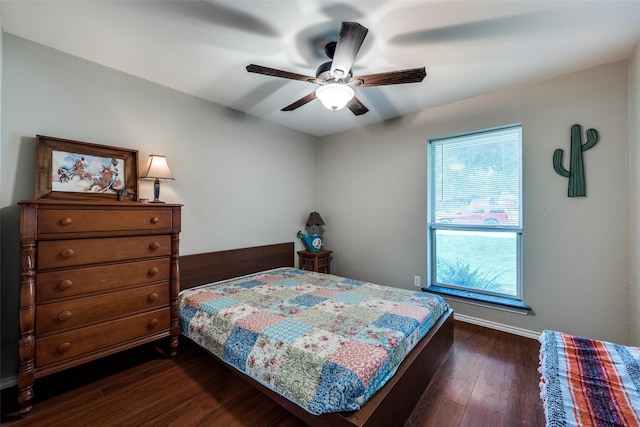 4920 Brookhollow Dr, Sachse, TX 75048 - bedroom with dark wood-style floors, baseboards, and ceiling fan