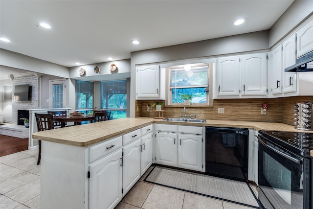 4920 Brookhollow Dr, Sachse, TX 75048 - kitchen with black appliances, a sink, a peninsula, light tile patterned flooring, and light countertops