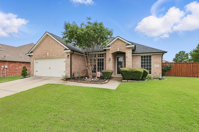 313 Owen Oaks Dr, Lake Dallas, TX 75065 - view of front of property with brick siding, a garage, driveway, and roof with shingles