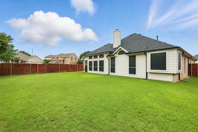 313 Owen Oaks Dr, Lake Dallas, TX 75065 - back of property with a chimney, a fenced backyard, and roof with shingles