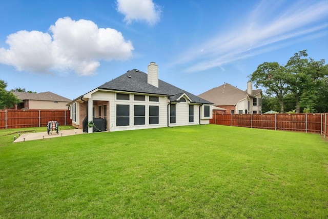 313 Owen Oaks Dr, Lake Dallas, TX 75065 - back of property featuring a patio area, a fenced backyard, a chimney, and a shingled roof