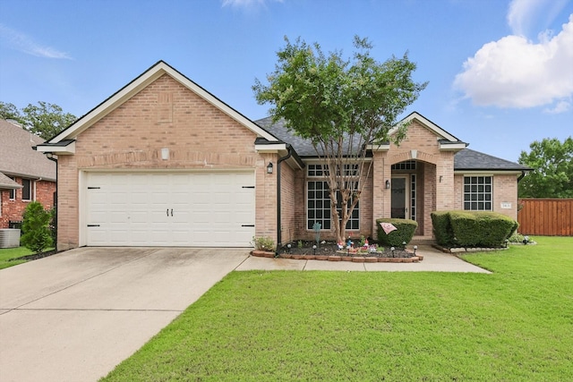 313 Owen Oaks Dr, Lake Dallas, TX 75065 - view of front of house featuring brick siding, concrete driveway, a garage, and roof with shingles