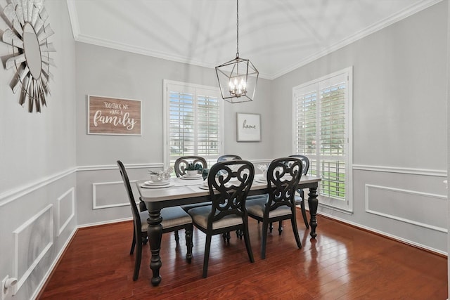 313 Owen Oaks Dr, Lake Dallas, TX 75065 - dining room featuring ornamental molding, a wainscoted wall, a chandelier, wood finished floors, and a decorative wall