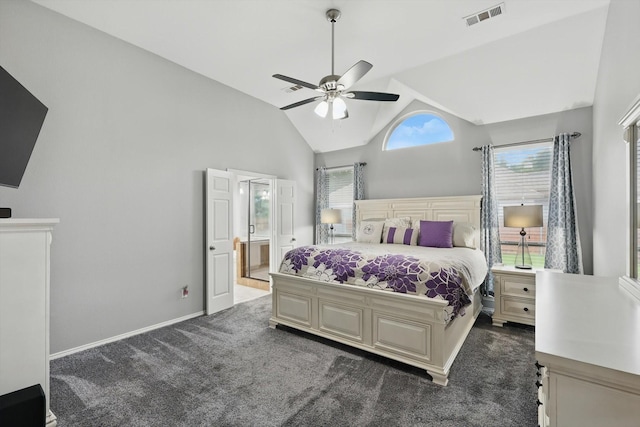 313 Owen Oaks Dr, Lake Dallas, TX 75065 - carpeted bedroom featuring multiple windows, ensuite bathroom, ceiling fan, and high vaulted ceiling