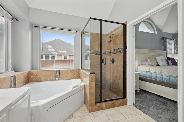 313 Owen Oaks Dr, Lake Dallas, TX 75065 - ensuite bathroom featuring a bath, a shower stall, tile patterned floors, vaulted ceiling, and vanity