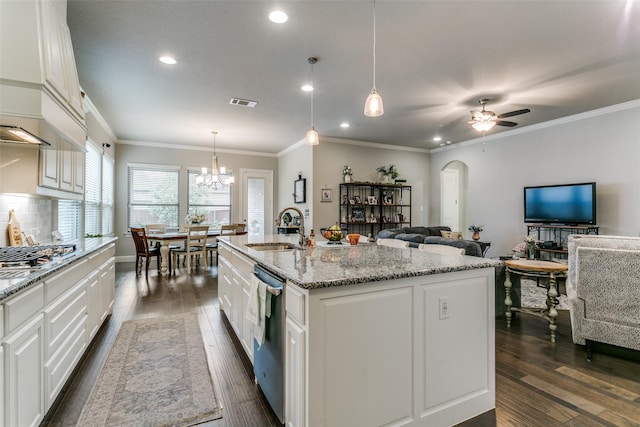 6929 Heather Ln, North Richland Hills, TX 76182 - kitchen with a sink, stainless steel appliances, dark wood finished floors, white cabinetry, and light stone countertops