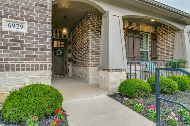 6929 Heather Ln, North Richland Hills, TX 76182 - view of exterior entry with covered porch and brick siding