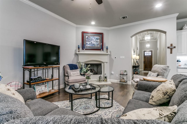 6929 Heather Ln, North Richland Hills, TX 76182 - living room with arched walkways, a ceiling fan, ornamental molding, wood finished floors, and recessed lighting