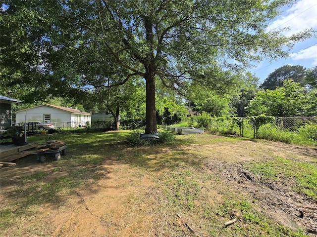 703 Jeanell St, Quitman, TX 75783 - view of yard featuring a garden