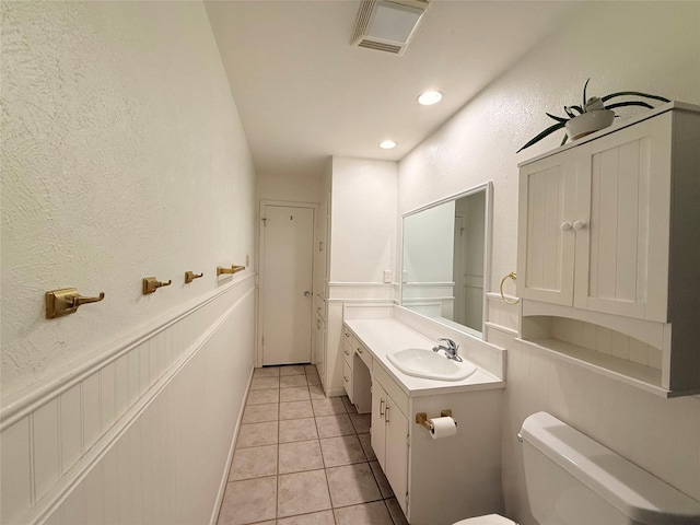 282 Rockford Rd, Woodway, TX 76712 - bathroom with vanity, tile patterned floors, a textured wall, and recessed lighting