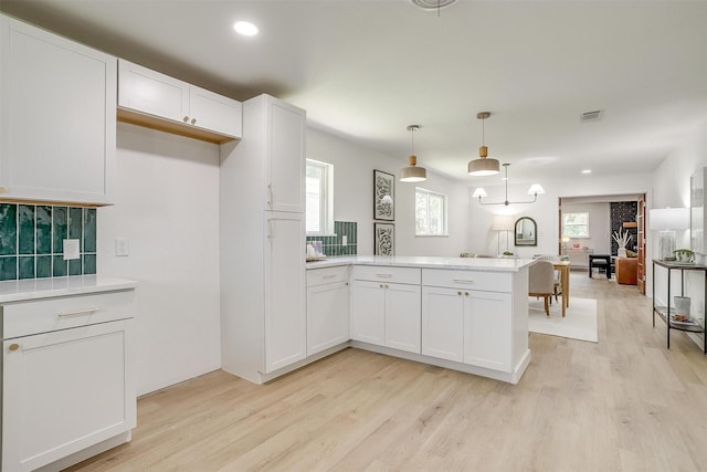 3908 Shawnee Trl, Lake Worth, TX 76135 - kitchen with a peninsula, light wood finished floors, open floor plan, light countertops, and recessed lighting