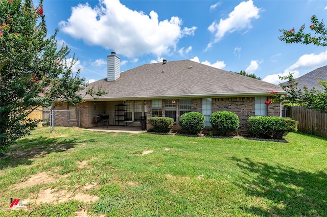 6008 Pepperwood Cir, Bossier City, LA 71111 - rear view of house featuring brick siding, a patio, a chimney, and roof with shingles