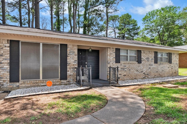 9346 Shartel Dr, Shreveport, LA 71118 - view of exterior entry featuring brick siding and covered porch