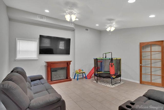 9346 Shartel Dr, Shreveport, LA 71118 - living area with a ceiling fan, recessed lighting, and a glass covered fireplace