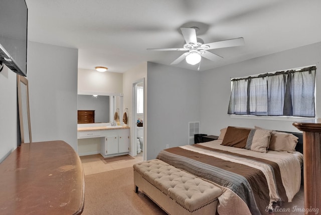 9346 Shartel Dr, Shreveport, LA 71118 - bedroom with ceiling fan and ensuite bathroom