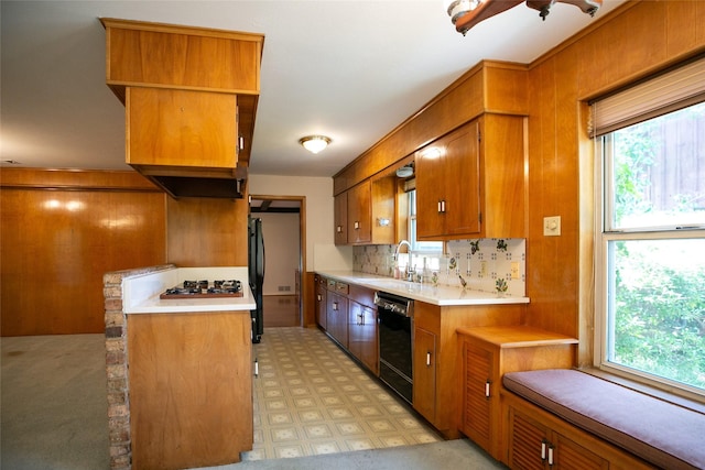 10210 E Lk Highlands, Dallas, TX 75218 - kitchen featuring black appliances, brown cabinets, a sink, light countertops, and light floors