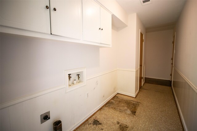 10210 E Lk Highlands, Dallas, TX 75218 - laundry area featuring cabinet space, electric dryer hookup, washer hookup, a wainscoted wall, and light carpet