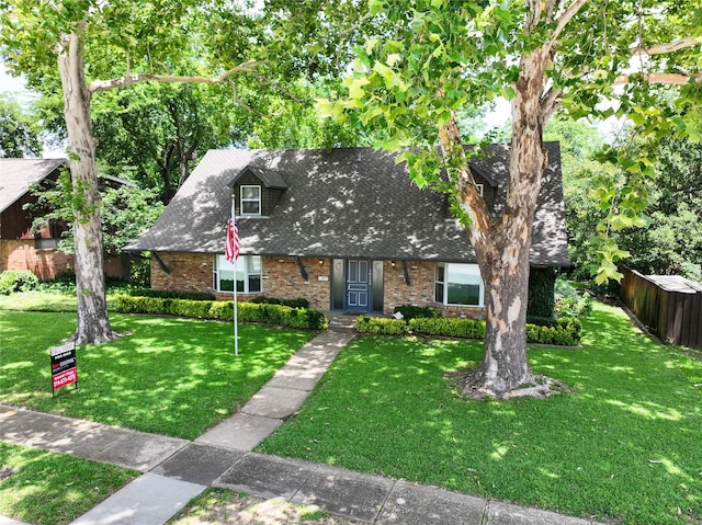 10210 E Lk Highlands, Dallas, TX 75218 - view of front of house featuring brick siding and a shingled roof