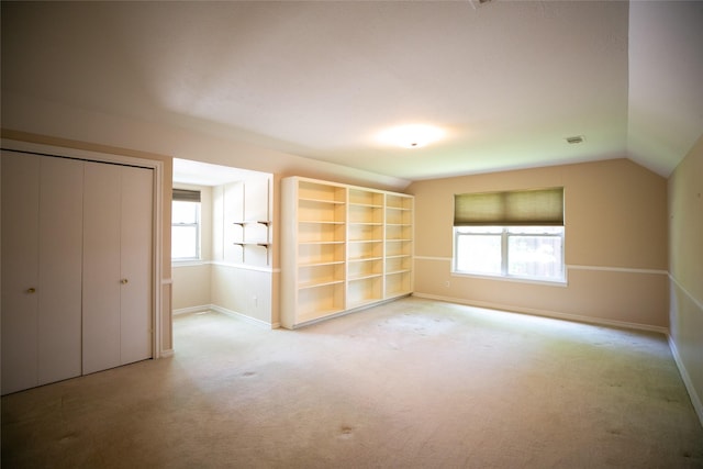 10210 E Lk Highlands, Dallas, TX 75218 - unfurnished bedroom featuring carpet floors, baseboards, a closet, and vaulted ceiling