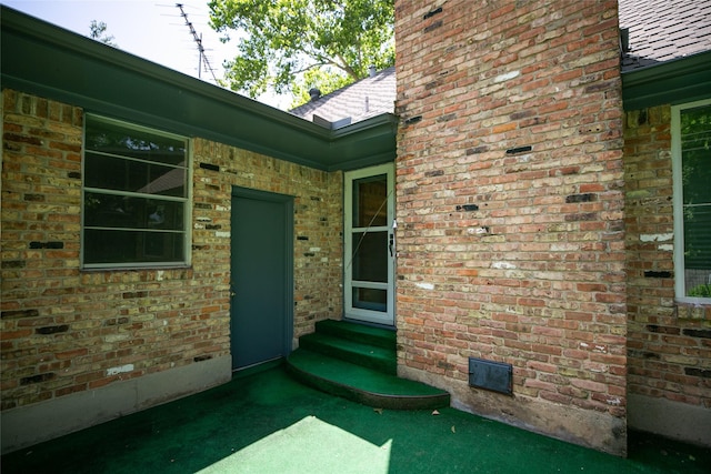 10210 E Lk Highlands, Dallas, TX 75218 - entrance to property with crawl space, brick siding, and a shingled roof