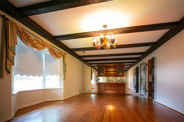 10210 E Lk Highlands, Dallas, TX 75218 - unfurnished living room with wood finished floors, beam ceiling, a chandelier, and baseboards