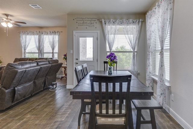 1541 Seabiscuit Dr, Granbury, TX 76049 - dining room with dark wood-style floors, a ceiling fan, and baseboards