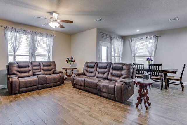 1541 Seabiscuit Dr, Granbury, TX 76049 - living area featuring a barn door, a ceiling fan, recessed lighting, light wood finished floors, and baseboards