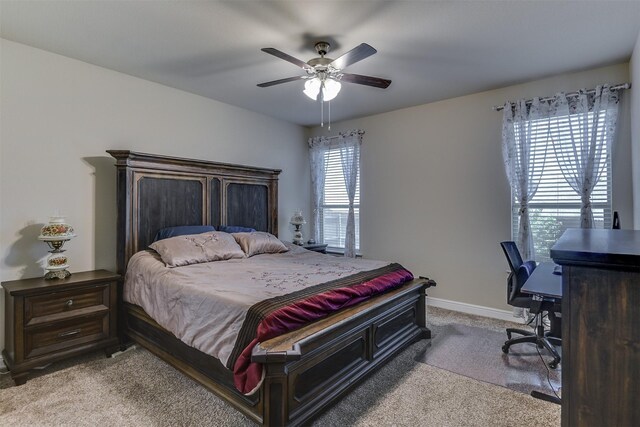 1541 Seabiscuit Dr, Granbury, TX 76049 - bedroom with light carpet, a desk, a ceiling fan, and baseboards