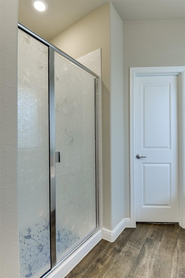 1541 Seabiscuit Dr, Granbury, TX 76049 - bathroom with wood finished floors, a shower stall, and baseboards