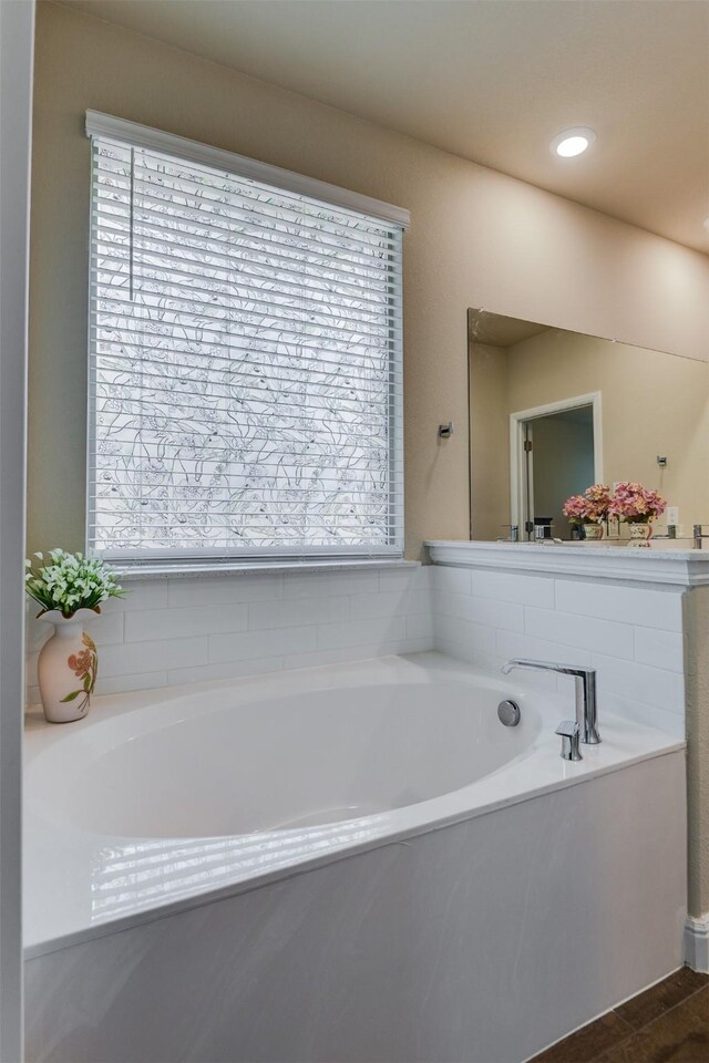 1541 Seabiscuit Dr, Granbury, TX 76049 - full bathroom featuring wood finished floors, a stall shower, and baseboards