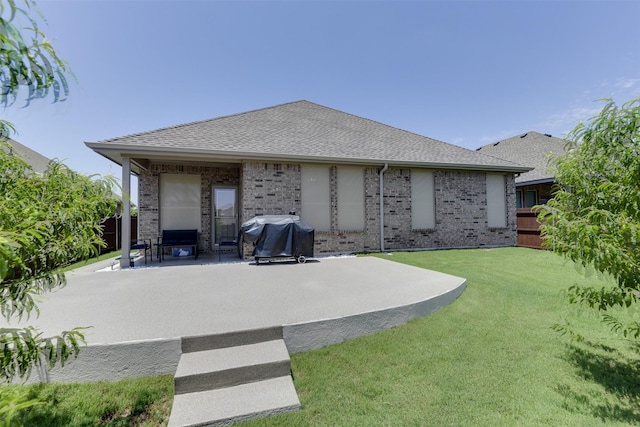 1541 Seabiscuit Dr, Granbury, TX 76049 - back of house with a patio, brick siding, and a shingled roof
