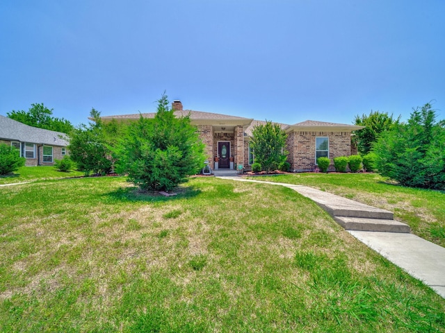 4640 Versailles Ln, Plano, TX 75093 - single story home featuring a front lawn, a chimney, and brick siding