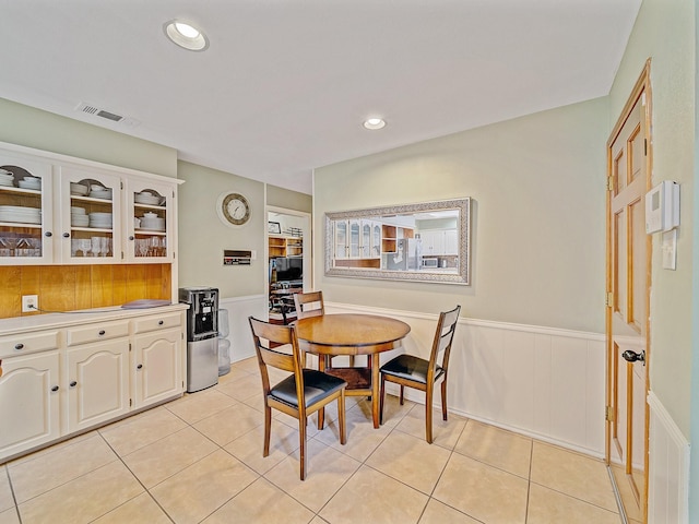 4640 Versailles Ln, Plano, TX 75093 - dining room with wainscoting, light tile patterned floors, and recessed lighting