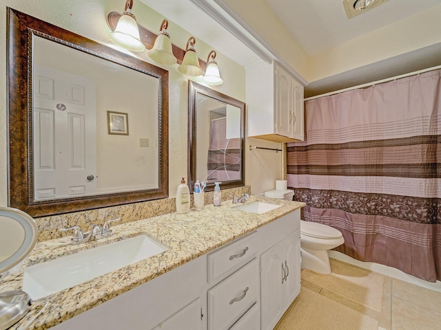 4640 Versailles Ln, Plano, TX 75093 - bathroom with toilet, double vanity, tile patterned floors, and a shower with shower curtain