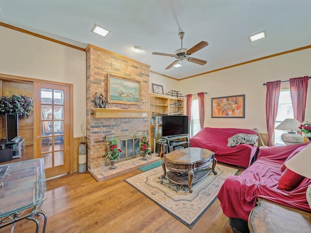 4640 Versailles Ln, Plano, TX 75093 - living area featuring crown molding, a ceiling fan, wood finished floors, and a fireplace