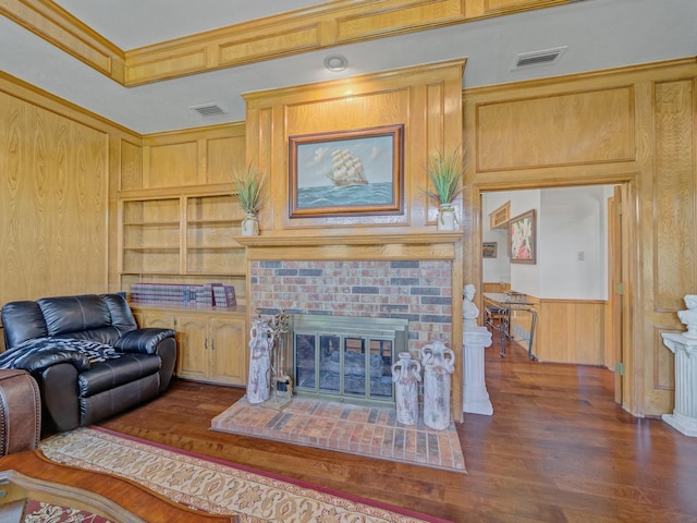 4640 Versailles Ln, Plano, TX 75093 - living area featuring wood walls, a fireplace, and wood finished floors