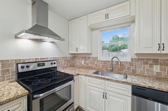 325 Belmont St, Hurst, TX 76053 - kitchen with stainless steel appliances, wall chimney range hood, backsplash, and light stone counters