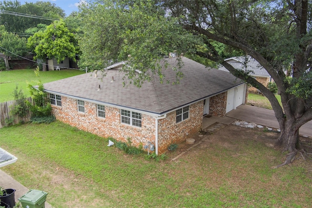 325 Belmont St, Hurst, TX 76053 - back of house with a shingled roof, concrete driveway, and an attached garage