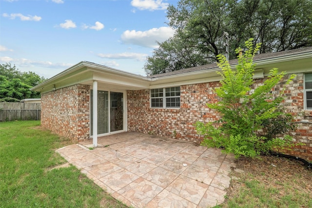 325 Belmont St, Hurst, TX 76053 - rear view of property with a patio and brick siding