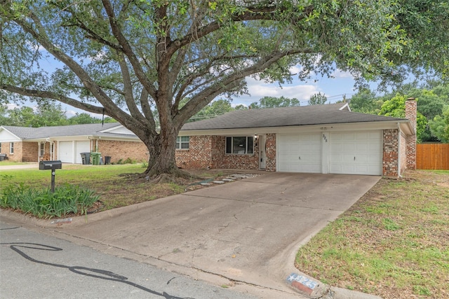 325 Belmont St, Hurst, TX 76053 - single story home with an attached garage, brick siding, and a chimney