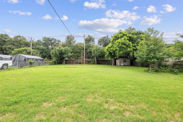 325 Belmont St, Hurst, TX 76053 - fenced backyard featuring a storage shed