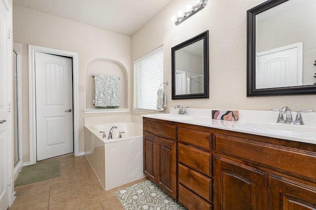 7609 Velvet Antler Trl, Arlington, TX 76002 - full bathroom featuring a bath, double vanity, tile patterned floors, and a stall shower