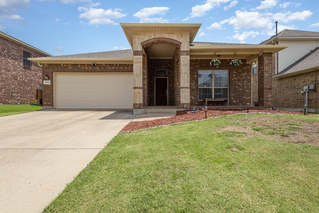 7609 Velvet Antler Trl, Arlington, TX 76002 - view of front of home featuring brick siding, a garage, concrete driveway, and a front yard