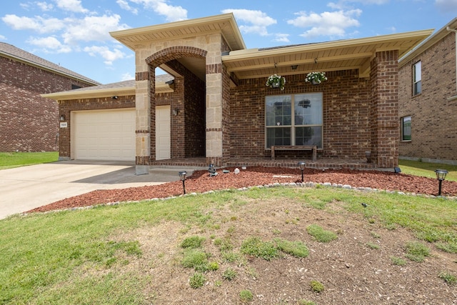 7609 Velvet Antler Trl, Arlington, TX 76002 - view of front of house with driveway, an attached garage, and brick siding