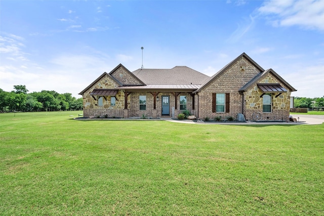 15070 Fm 916, Maypearl, TX 76064 - view of front of house with a front yard, a standing seam roof, and stone siding